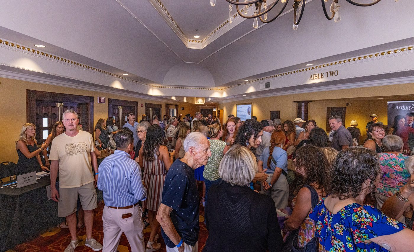 Guests filling the lobby during pre-show activities and the silent auction.